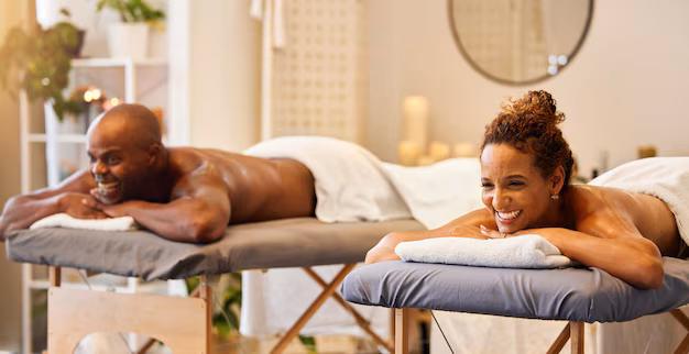 Couple receiving side-by-side massages